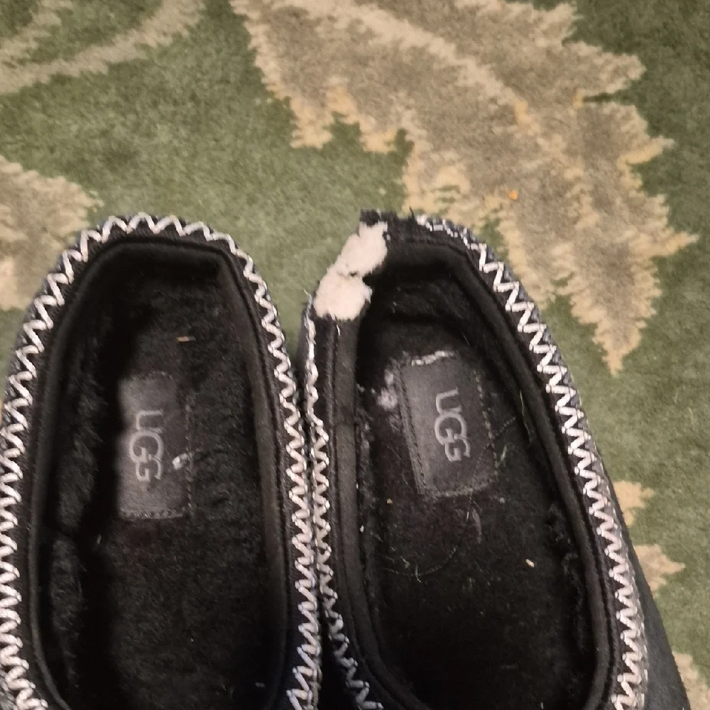 UGG Black Suede Slip-Ons with White Trim